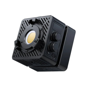 Compact Ulanzi LED cube with cooling vents and adjustable color temperature controls.